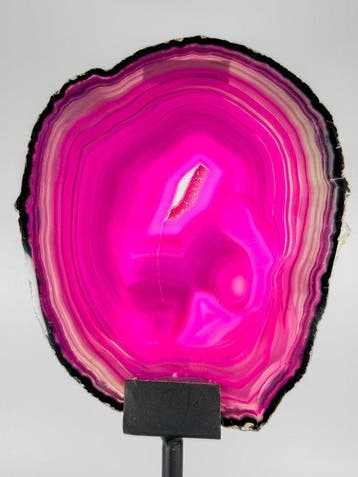 Very unique pink / black colored agate slice on stand