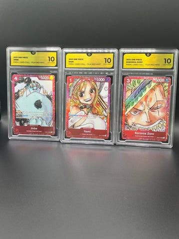 Bandai - 3 Graded card - One Piece Nami Jinbe & Zoro Red, Hobby en Vrije tijd, Verzamelkaartspellen | Overige, Nieuw
