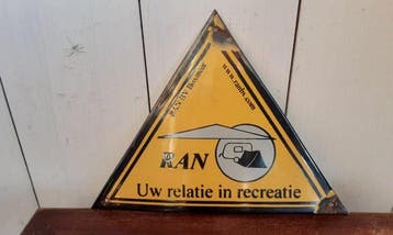 This is a triangular yellow advertising sign or gable sign