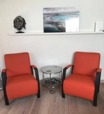 Set van 2 leren fauteuils met stalen frame - oranje leer, Huis en Inrichting, Fauteuils, Ophalen of Verzenden, Nieuw