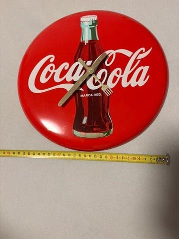 Horloge murale ovale Coca-Cola, 30 cm; tôle émaillée à