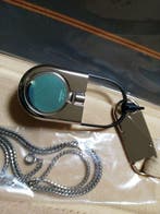 Collectie van memorabilia - tafelklok en kettinghorloge