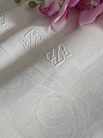 ** Tafelkleed met tien linnen servetten met art-deco-rozen,
