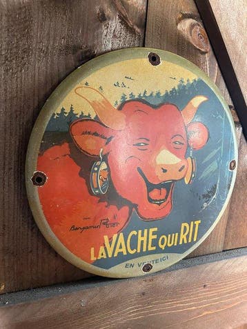 Prachtig rond vintage emaille reclamebord van La Vache qui