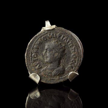 Oud-Romeins Munthanger met antieke munt van Filips II de