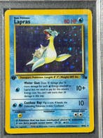 Pokémon - 1 Graded card - Lapras Holo, Fossil #10 First, Hobby en Vrije tijd, Verzamelkaartspellen | Pokémon, Nieuw