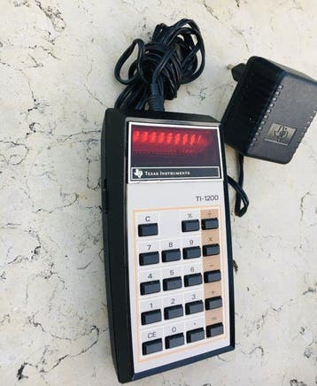 Casio TI-1200 texas instrument + Chargeur dorigine -