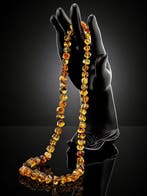 Barnsteen - Elegant Amber Necklace – Geometric Cut Beads –