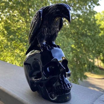 Hand-Carved Raven on Skull Sculpture – African Gothic Resin