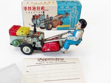 Zeldzame litho blikken handtractor met opwindsleutel en doos
