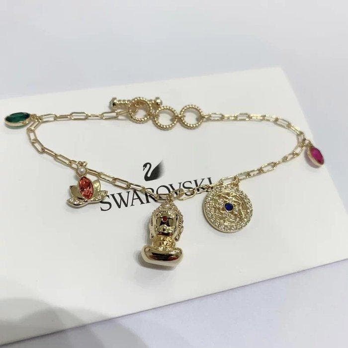 Swarovski - Métal, cristal - Gourmette - Bouddha doré, Antiquités & Art, Curiosités & Brocante