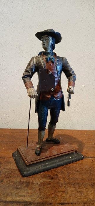 Figurale pendule - Folk Art Uhrentrager cast iron