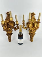 Decoratief ornament - Een paar vergulde wandlampen. - Italië