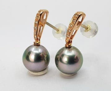 Oorbellen - 14 karaat Roségoud - 0.08ct. tw. - 10×11 mm
