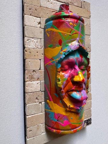 gregos - Colored mocking spray can on bricks