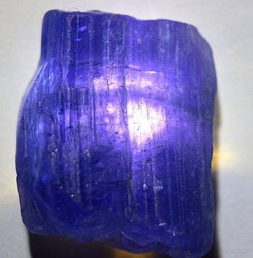 Ct. 47.10 Uitstekende blauwe tanzaniet, transparant paars -