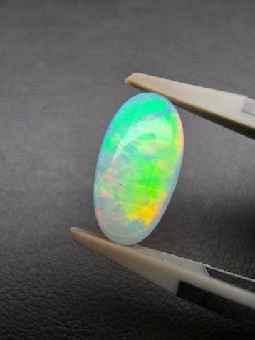 2.3cts White Opal Cabochon- 0.46 g