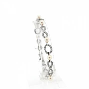 Witgouden infinityschakel armband met parel en zirconia |..., Handtassen en Accessoires, Armbanden, Gebruikt, Ophalen of Verzenden