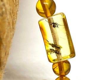 Baltische barnsteen ketting met 3 insecten - Vastgelegde