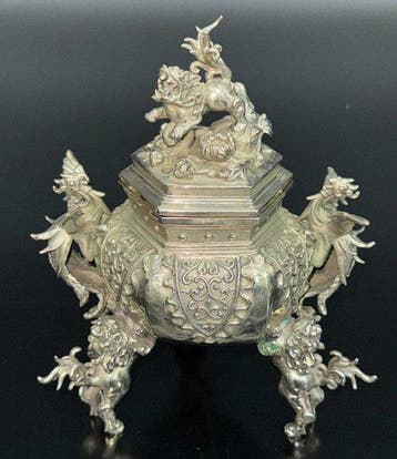 peonies and lions, featuring phoenix-shaped handles and