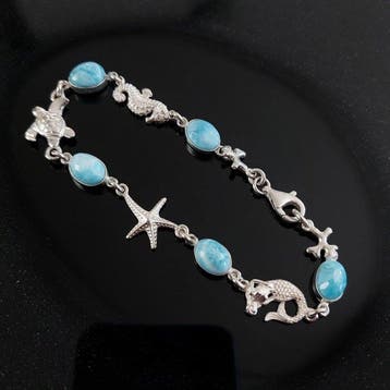 Larimar en 925 zilver rhodié. Sfeer van zon en lagune.
