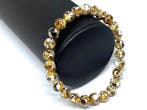De klassieke witte multikleurige Baltische amber armband met