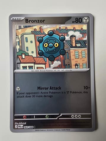 BRONZOR (PITCH BLACK 063/084) (REVERSE HOLO) (TRADING CARD), Gebruikt