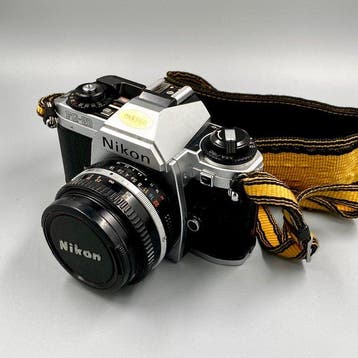 Nikon FG-20 + nikkor 50mm F1.8 Single lens reflex camera