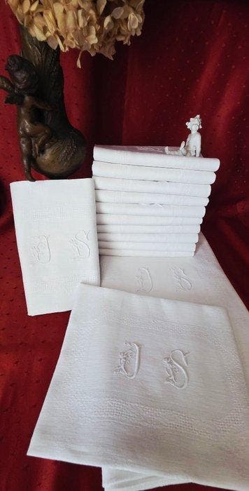 Tafellaken met zijn twaalf servetten met monogram J S -