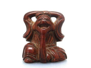 Grappige netsuke van Fukurokuju, een van de zeven goden van