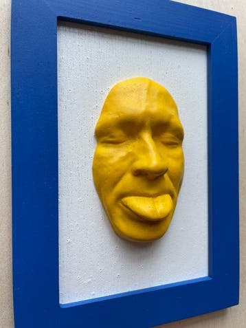 gregos - Yellow mockery on white background-blue frame