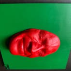 gregos - Red smile on green background
