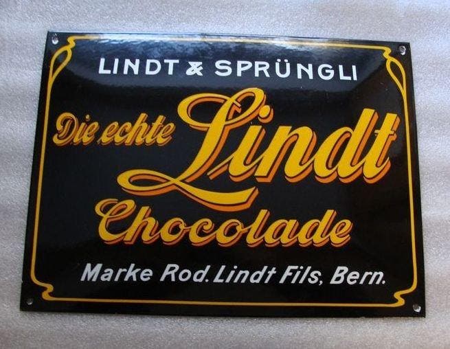 Lindt & Sprüngli - Lindt Chocolade Emailschild - Emaille, Antiek en Kunst, Antiek | Wandborden en Tegels