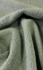 Bouclé-achtig weefsel met een warme, materiële structuur en