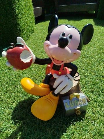 Disneys Mickey Mouse eating an Apple during a picnic - 1