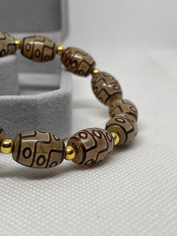 Exclusieve Tibetaanse armband met Dzi-kralen van agaat –