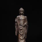 A gilt-copper statue of Amitabha Buddha from a private