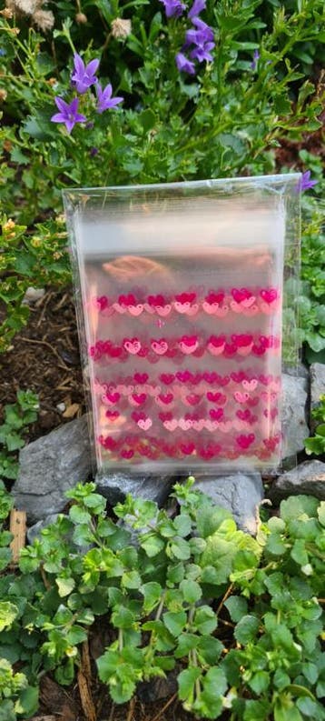 20x cellofaanzakje transparant hartjes roze 7x7cm, Ophalen of Verzenden, Cadeauzakje