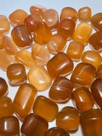 Honingcalciet, ook bekend als ambercalciet - getrommelde