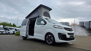 Crosscamp Flex minivan op Opel, keuken, bed in hefdak 47920, Buscamper of Camperbus