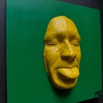 gregos - Yellow mockery on green background