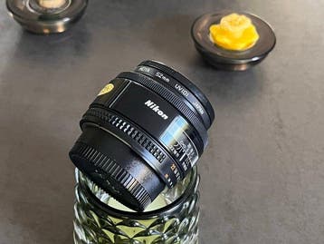 Nikon AF Nikkor f1,8/50mm lens + UV filter. Near mint, Nieuw