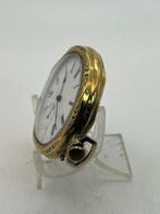 Revisionato . Orologio di forma in metallo dorato . Ancora .
