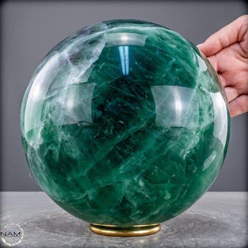 Sphère semi-transparente de fluorite bleu-vert de haute