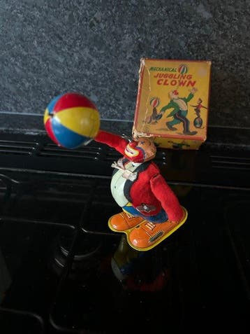 TPS - Clown jongleur mécanique - Jouet en étain à remontoir, Antiek en Kunst