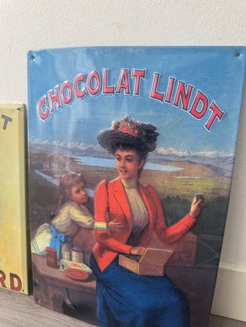 Chocolat Lindt & Suchard – 2 metalen reclameborden – Reliëf