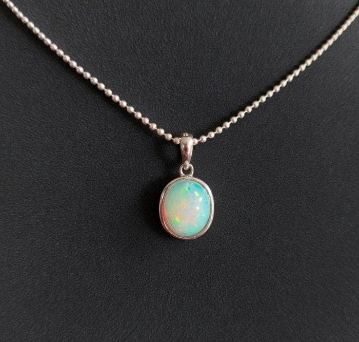 Hanger van Welo-opaal. Een uitzonderlijk kleurenpalet., Verzamelen, Mineralen en Fossielen