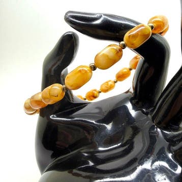 Armband met Baltisch amber kralen in butterscotchkleur -