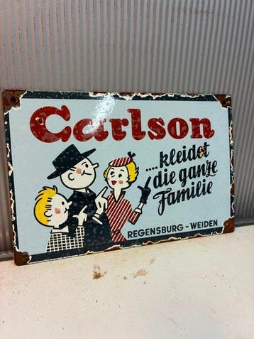 Carlson – Kleidet die ganze Familie – Emaille Reclamebord -