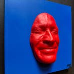 gregos - Red smile on blue background